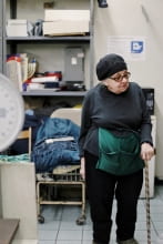 older woman in backroom